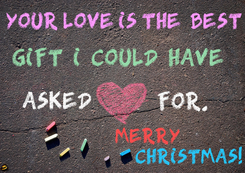 Image with romantic text: our love is the best gift I could have asked for! Merry Christmas. The text is written with colored chalks and a big heart in the middle